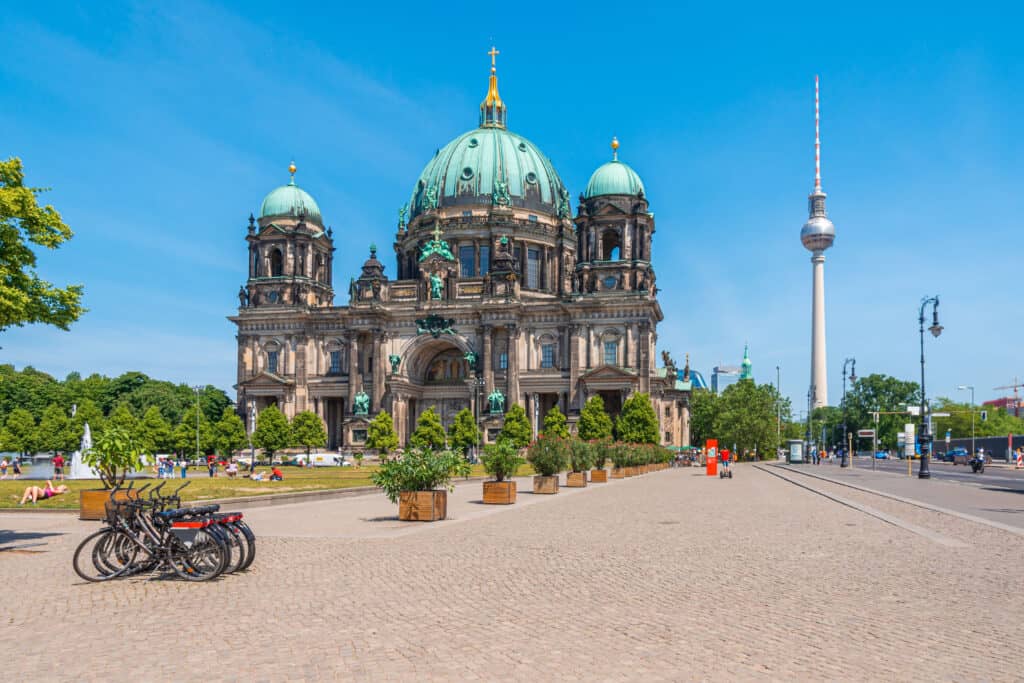 Berlin Cathedral, a majestic Baroque edifice with a green-domed roof and intricate stonework.