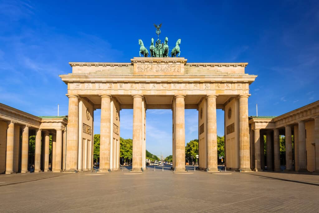 Front view, blue sky, Brandenburg Gate in Berlin at sunrise, Germany