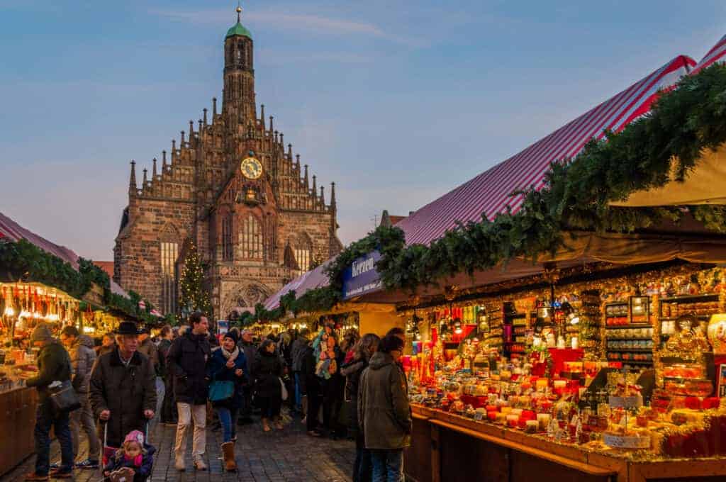 Christmas markets in Germany, here: People at Nuremberg Christmas market.