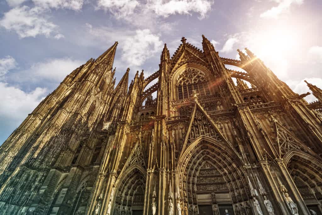 Cologne Cathedral, a towering Gothic masterpiece with intricate spires and stained glass windows.