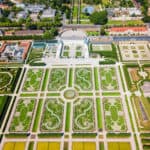 Aerial perspective of Herrenhausen Gardens in Hanover, a vast expanse of manicured greenery.