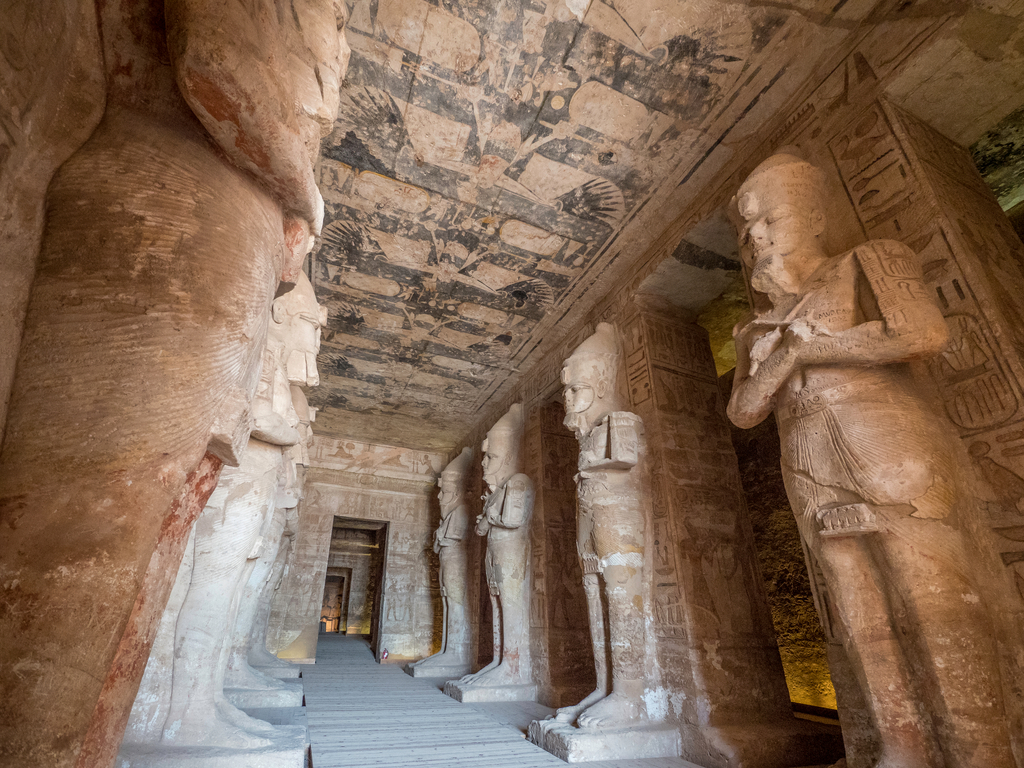 The interior of Abu Simbel, showing intricate hieroglyphics and carvings on the temple walls.