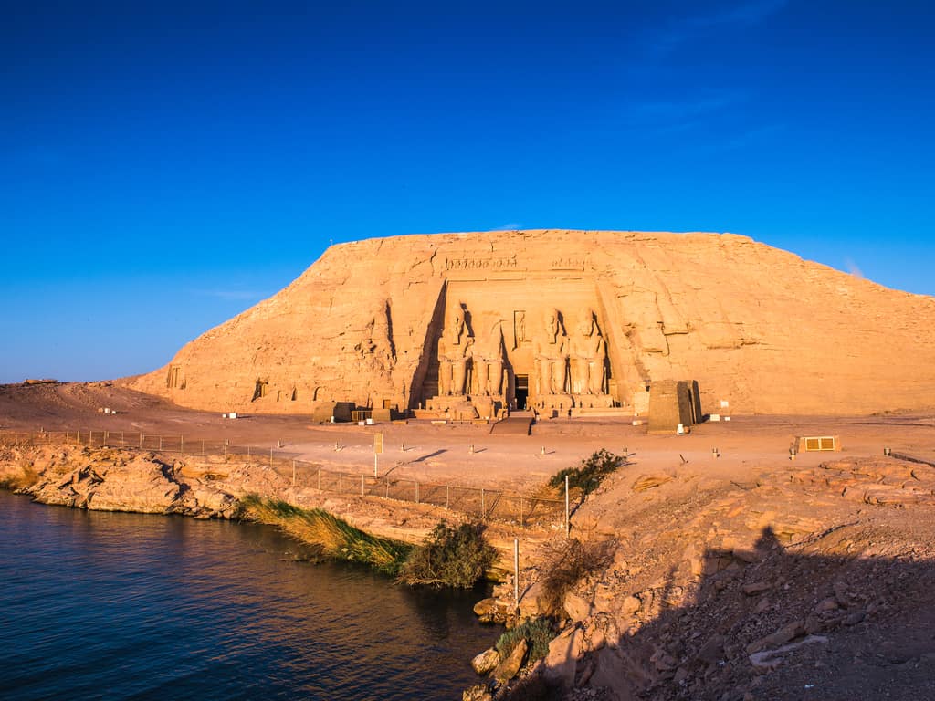 Tourists taking a guided tour to learn about the history and relocation of Abu Simbel.