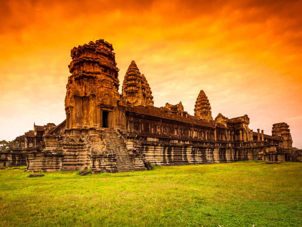 Sunrise at Angkor Wat Temple in Siem Reap, Cambodia, showcasing the iconic silhouette against a vibrant morning sky