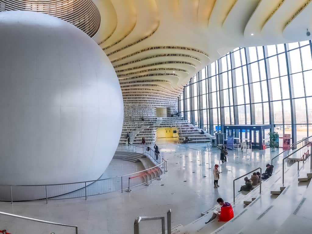 The luminous, airy atrium of Binhai Library, filled with natural light.