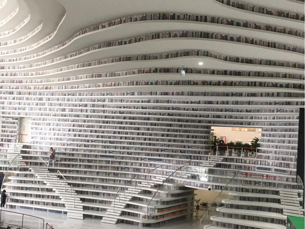 Spectacular view of the cascading bookshelves inside Binhai Library, Tianjin.