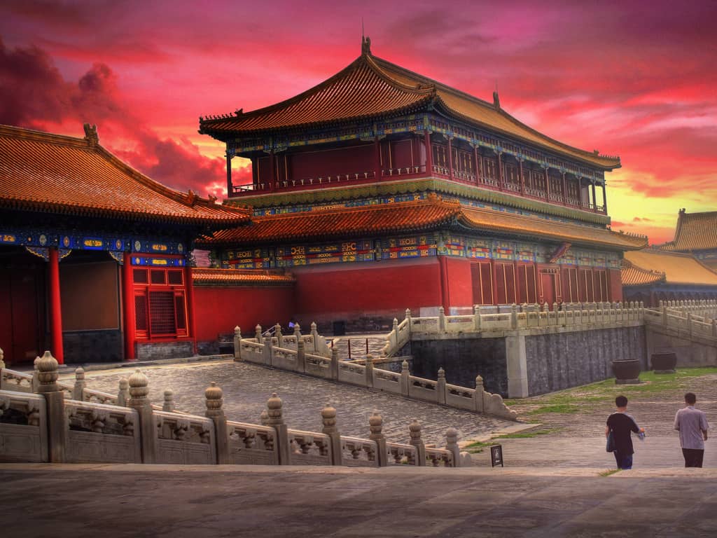"Panoramic view of the expansive Forbidden City, showcasing traditional Chinese architecture and red walls.