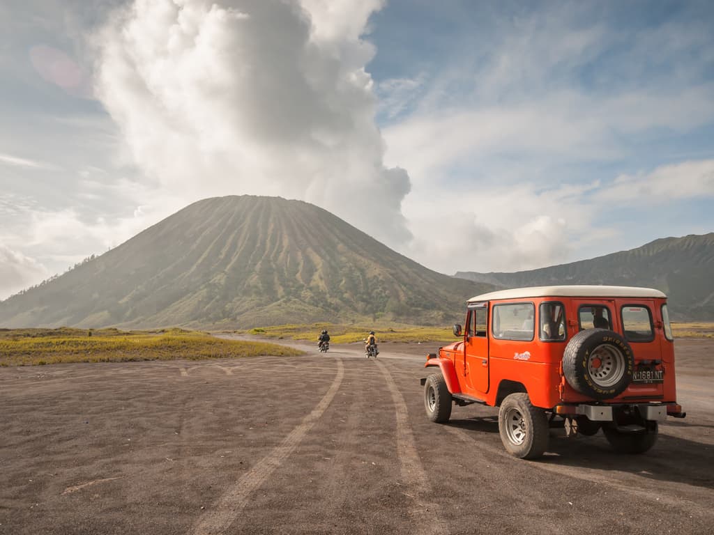 Colorful jeeps, ready to take adventurers closer to Mount Bromo.