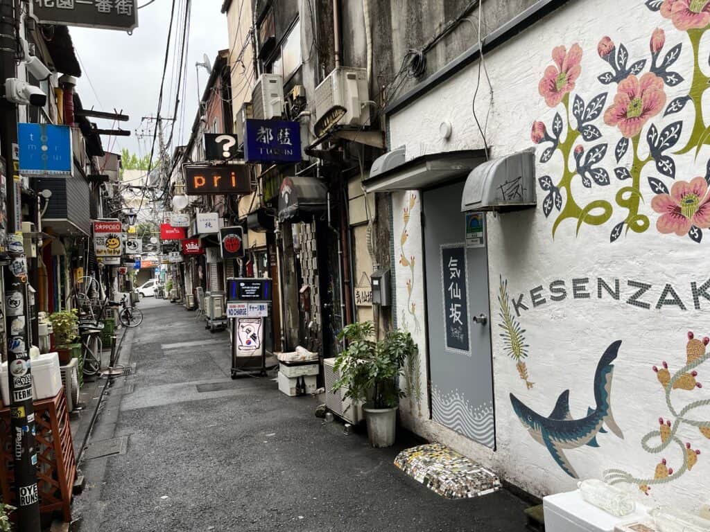 Eclectic signs and lanterns adorn the ramshackle facades of bars in the famous Golden Gai neighborhood in Tokyo, Japan.