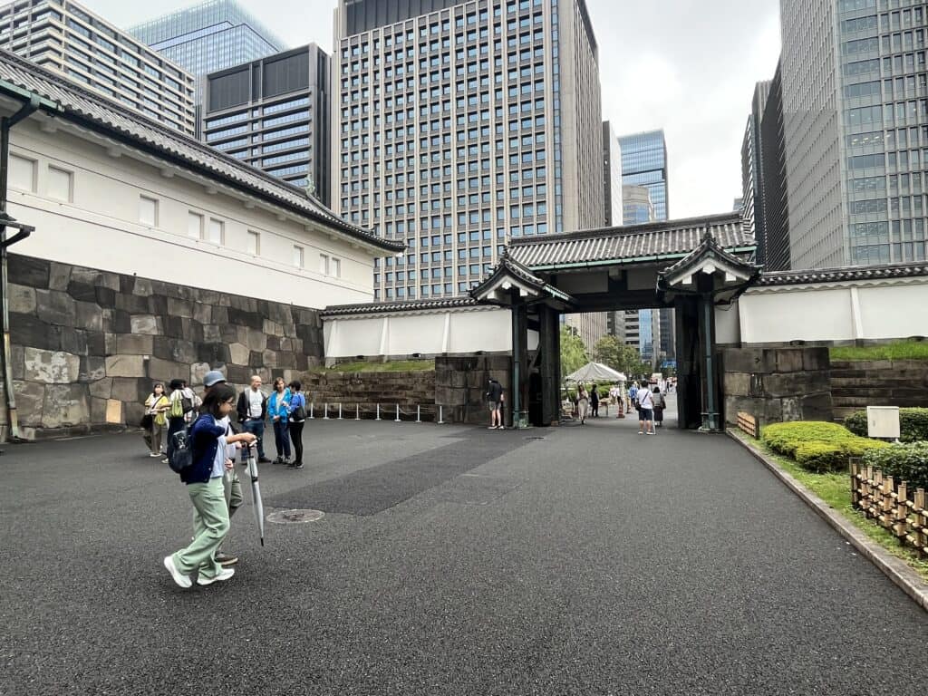 Historic Otemon Gate at Tokyo Imperial Palace with its imposing wooden doors and traditional stone wall.