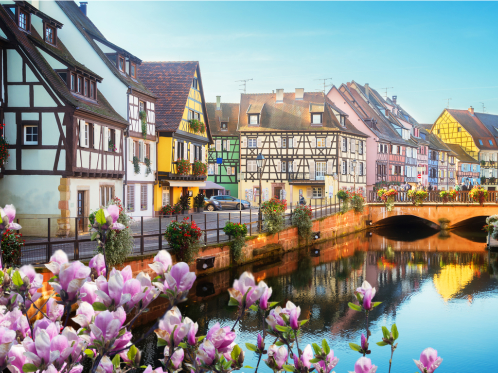 Floral displays adorning the bridges over Colmar's canals, adding to the town's charm