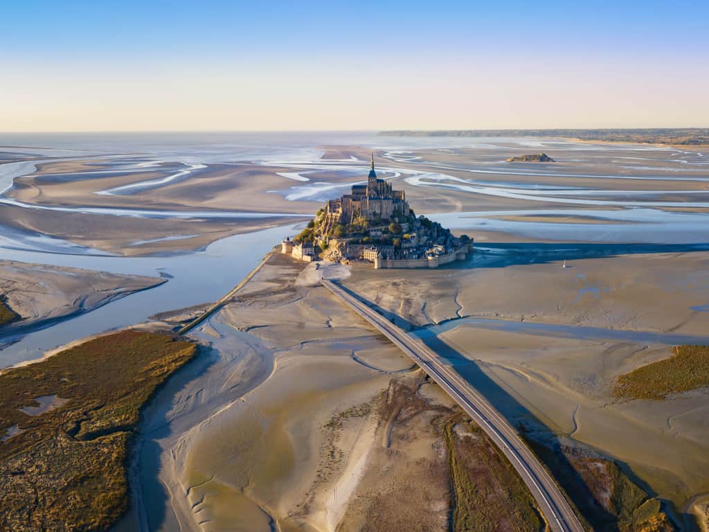 Aerial view of Mont Saint Michel, showcasing its unique location and structure.