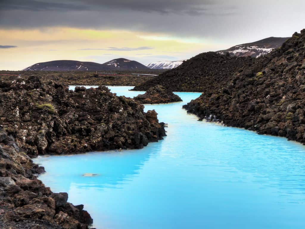Aerial view of the Blue Lagoon, showcasing its vast size and unique color in the Icelandic landscape
