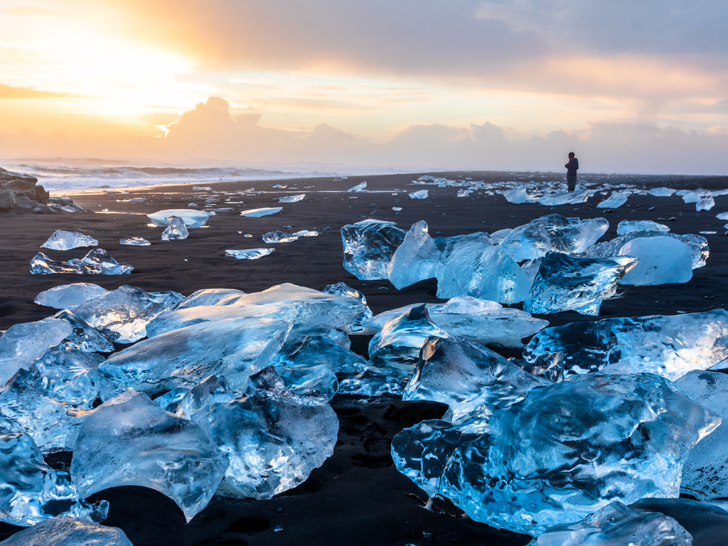 Photographer capturing the stunning scenery of Jokulsarlon, a paradise for photography enthusiasts.