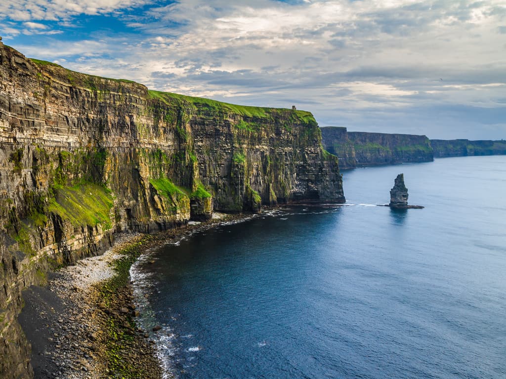 The Cliffs of Moher shrouded in mist, creating a mystical and atmospheric landscape.