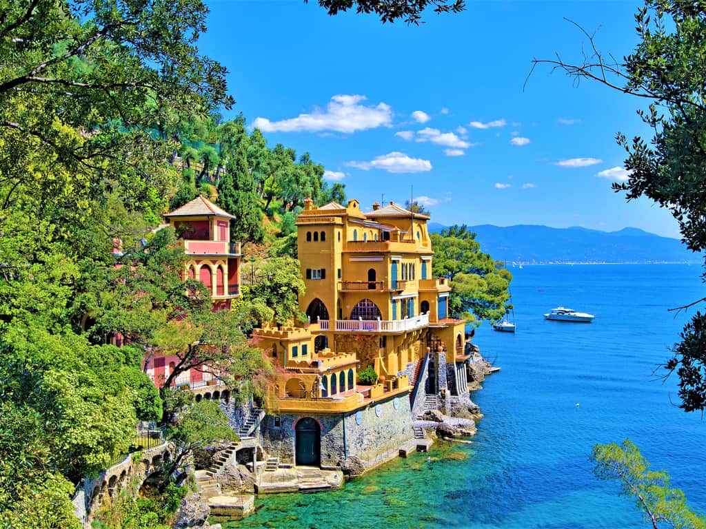 Panoramic view of Portofino from Castello Brown, showcasing the village's picturesque setting.