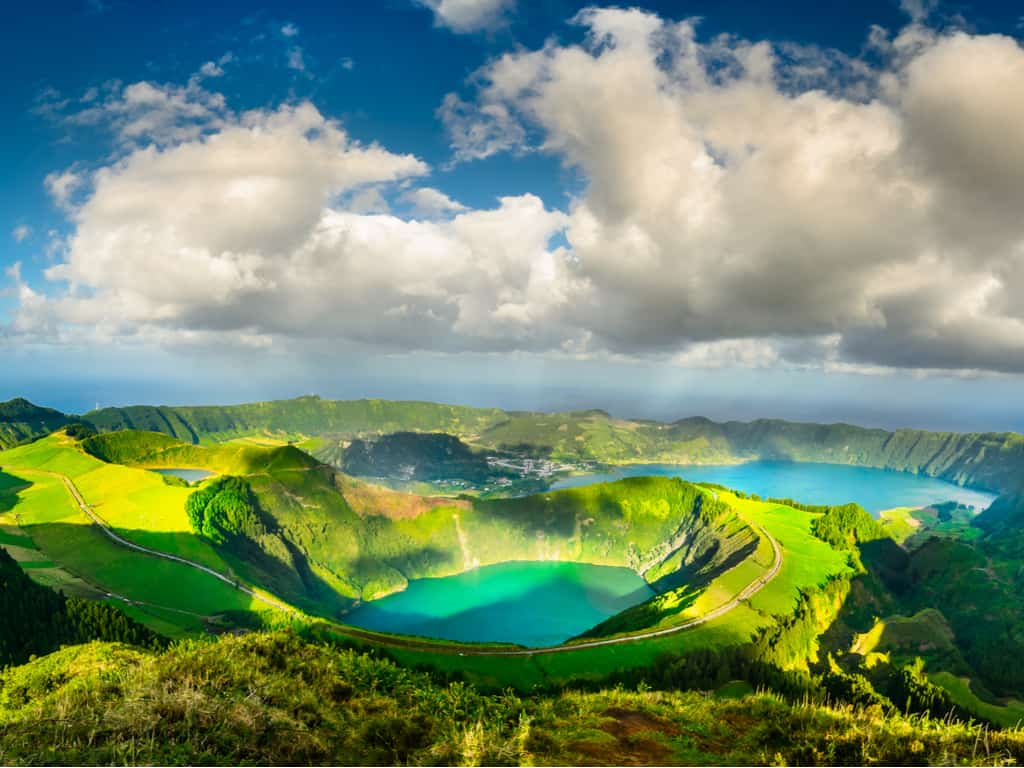 Panoramic view of the lush green landscape and crater lakes of Sete Cidades in the Azores.