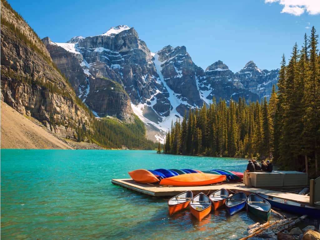 Canoeing on the serene Lake Louise in Banff National Park, a peaceful way to explore Canada's natural landscapes