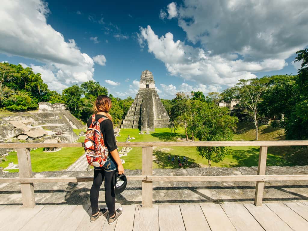 Hikers exploring the jungle trails leading to the remote temples of Tikal