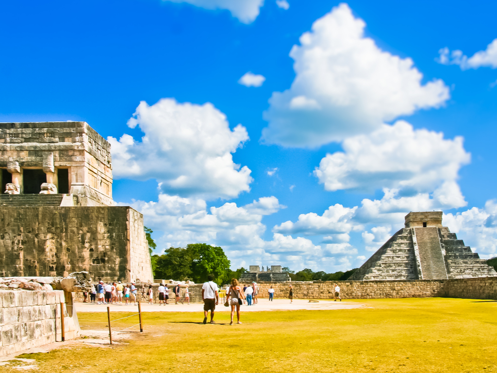 Visitors exploring the Great Ball Court at Chichen Itza, the largest in Mesoamerica.