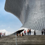 Exterior view of the Soumaya Museum's distinctive silver facade, a modern architectural marvel in Mexico City
