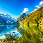 Mirror Lakes reflecting the stunning scenery of Fiordland, a peaceful and picturesque spot.
