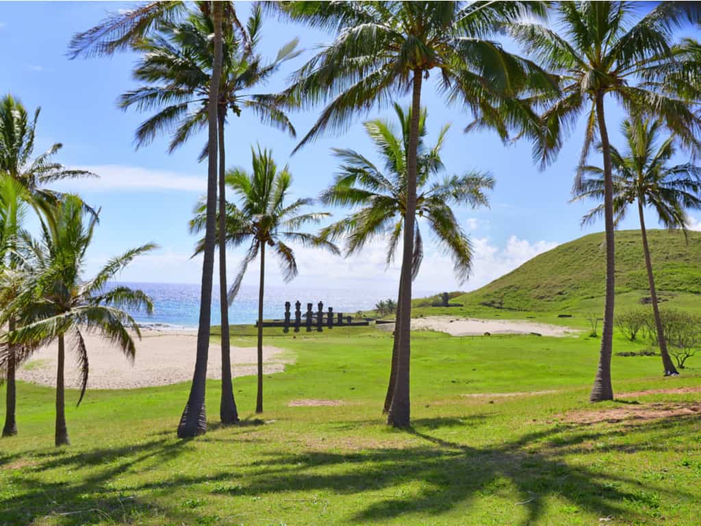 The serene Anakena Beach on Easter Island, with its white sands and moai statues overlooking the Pacific Ocean